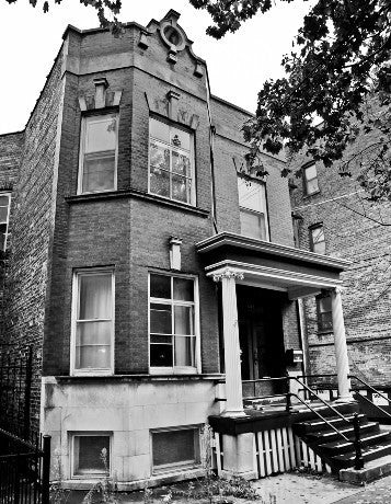 highly detailed and heavily ornamented original oversized cast bronze chicago two-flat exterior or entrance door backplate with cherub and deeply embossed floral motifs