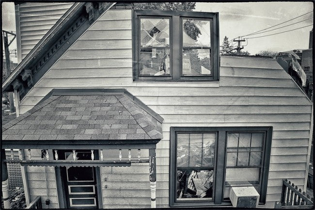 single shortened 19th century chicago balloon frame american industrial solid pine wood residential foundation post or piling repurposed into a freestanding display stand