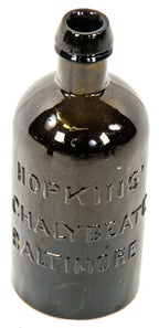 rare  mid-nineteenth century yellow olive pint shaped "chalybeate" mineral water bottle manufactured for william hopkins in baltimore, md.