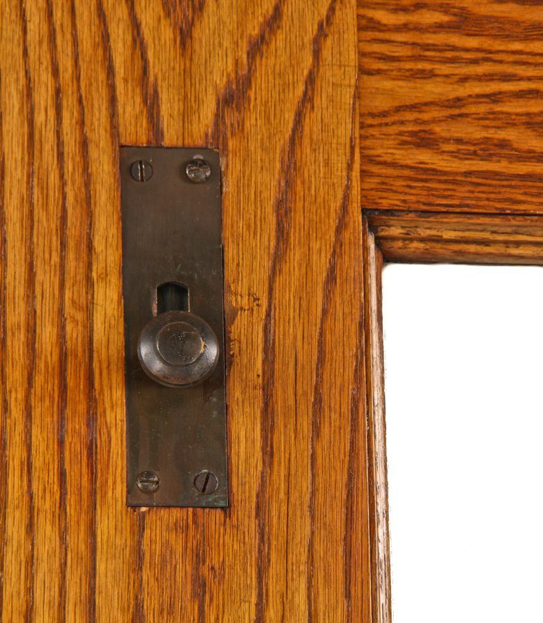 pair of original c. 1897 exterior chicago two-flat residential two-part or double door assembly comprised of varnished oak wood with beveled edge plate glass panes