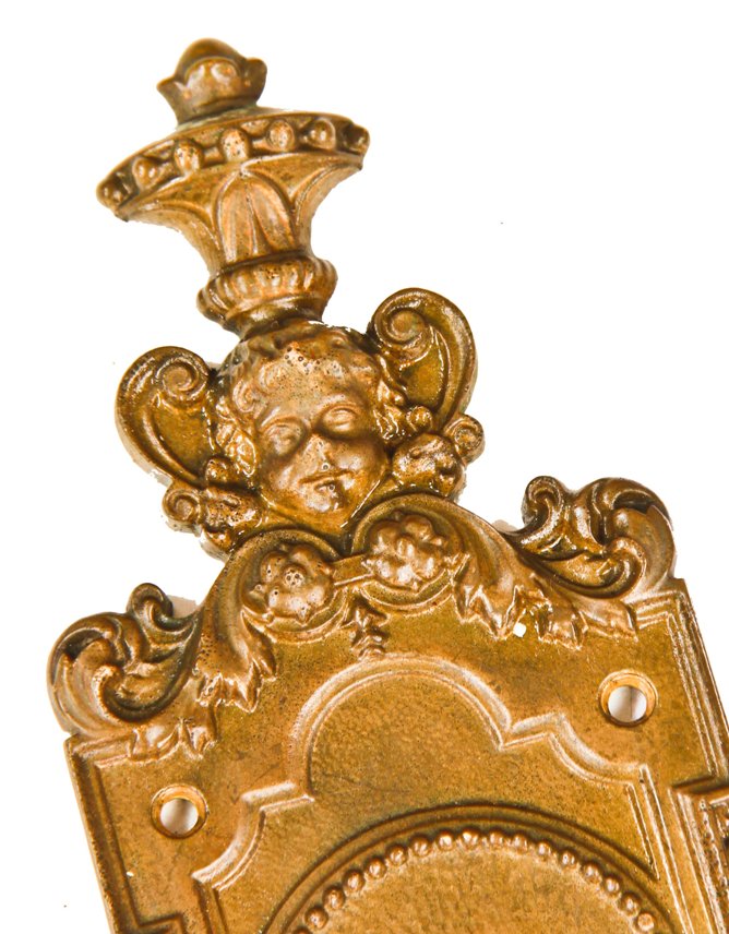 highly detailed and heavily ornamented original oversized cast bronze chicago two-flat exterior or entrance door backplate with cherub and deeply embossed floral motifs