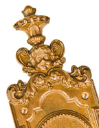 highly detailed and heavily ornamented original oversized cast bronze chicago two-flat exterior or entrance door backplate with cherub and deeply embossed floral motifs