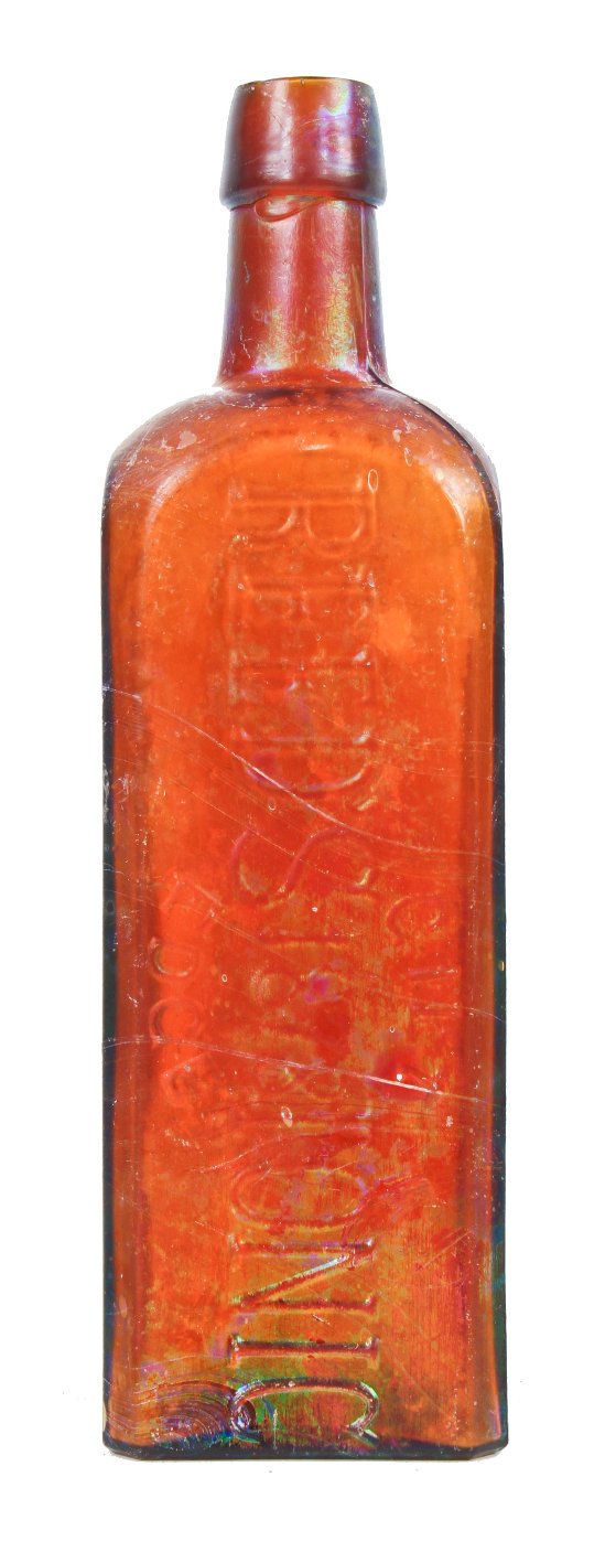 heavily iridized 19th century privy dug antique american square amber bitters bottle with tapered collar manufactured for geo w.m. reed in connecticut.