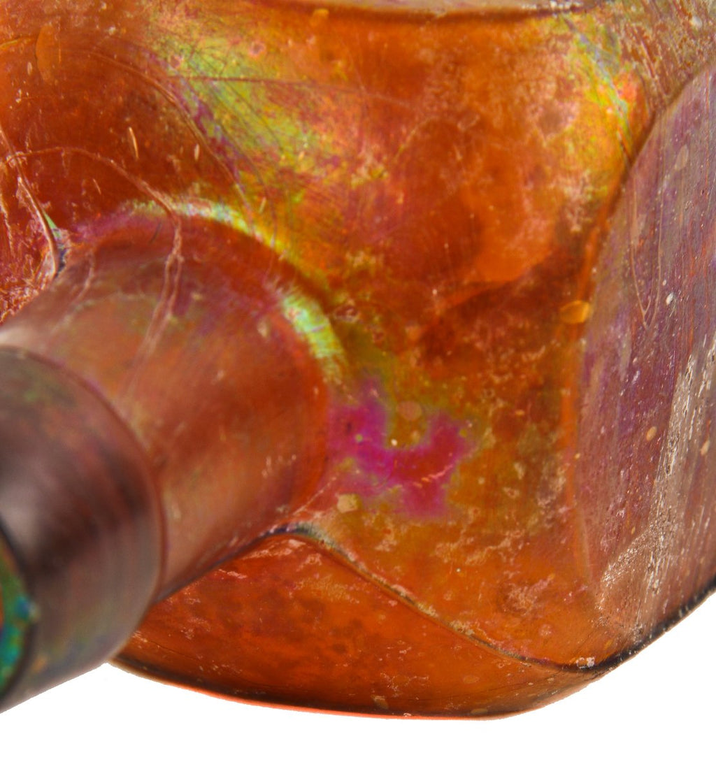 heavily iridized 19th century privy dug antique american square amber bitters bottle with tapered collar manufactured for geo w.m. reed in connecticut.