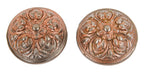 two mating deeply embossed ornamental cast iron interior residential passage door banded rim doorknobs with traces of a copper-plated finish