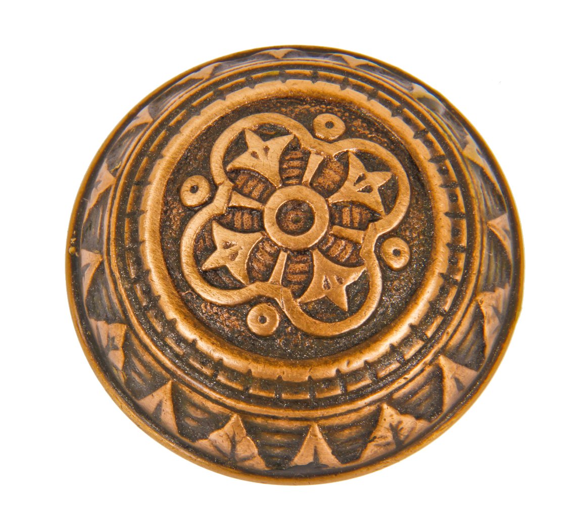 original 19th century passage size ornamental cast brass banded rim dome-shaped interior residential doorknob with a repeating floral motif border