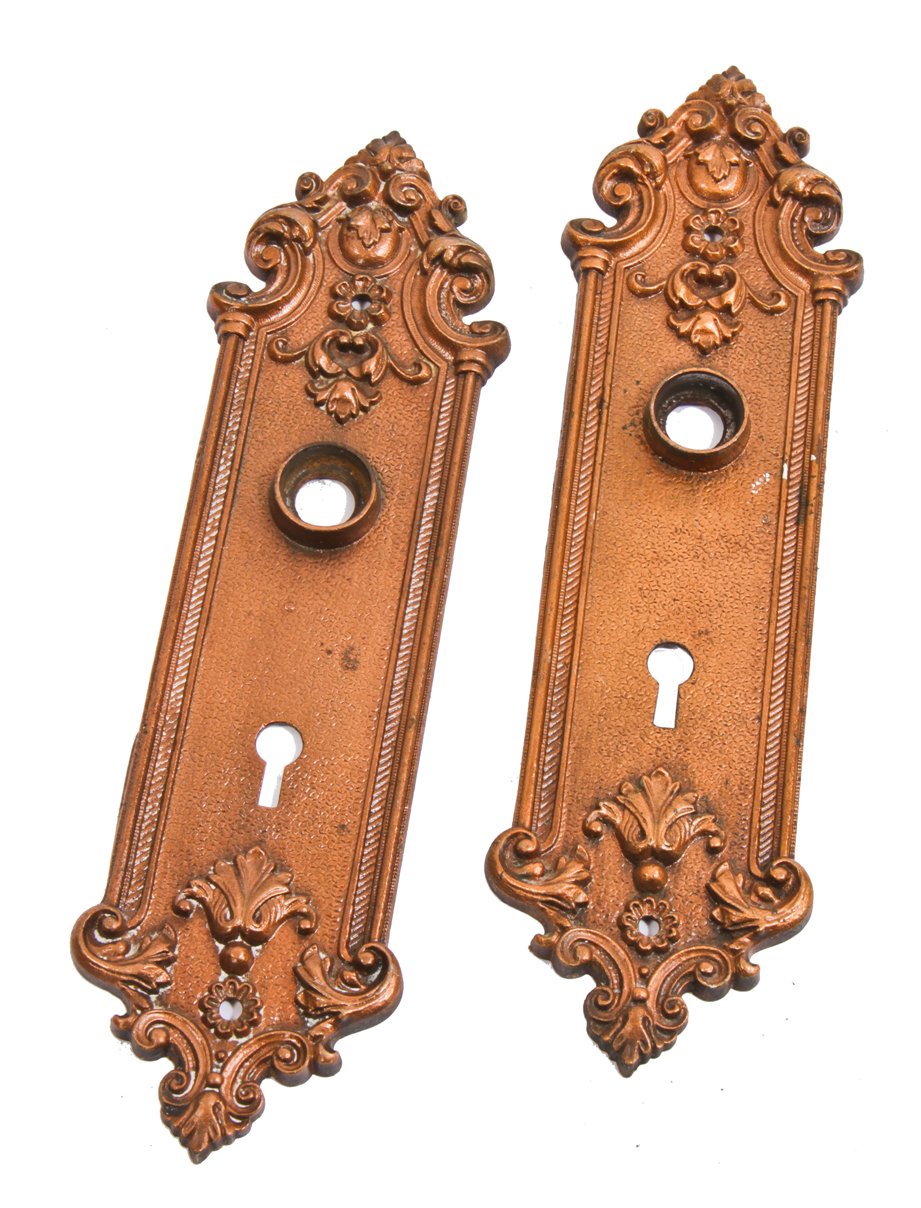 matching set of original late 19th century antique american ornamental copper-plated chicago two-flat residential passage door escutcheons or backplates