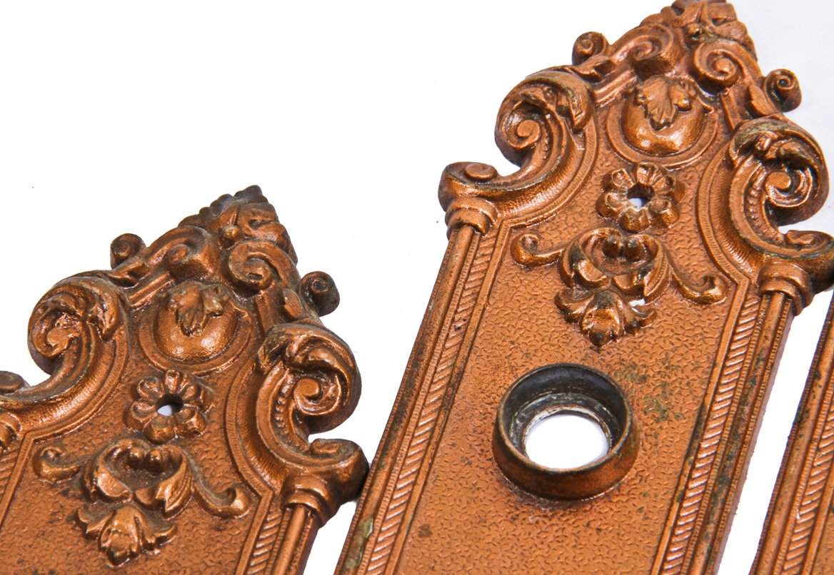 matching set of original late 19th century antique american ornamental copper-plated chicago two-flat residential passage door escutcheons or backplates