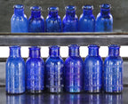 six matching original 19th century antique american medical chicago privy dug richly colored cobalt blue squat neck bromo-seltzer glass bottles with embossed lettering