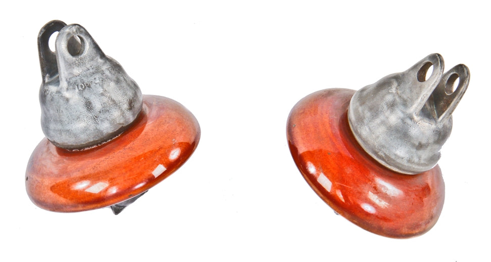 pair of vintage original american industrial reddish-brown glazed heavy duty suspension type transmission line insulators with cast iron bracket hoods and eye hooks