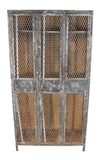 highly desirable early 20th century american industrial 3-unit freestanding cold-rolled riveted joint sheet iron factory lavatory locker with diamond steel mesh doors