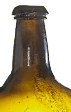 very rare and all original antique early nineteenth century free-blown and iron pontiled deep olive amber glass bottle manufactured for unknown bottler