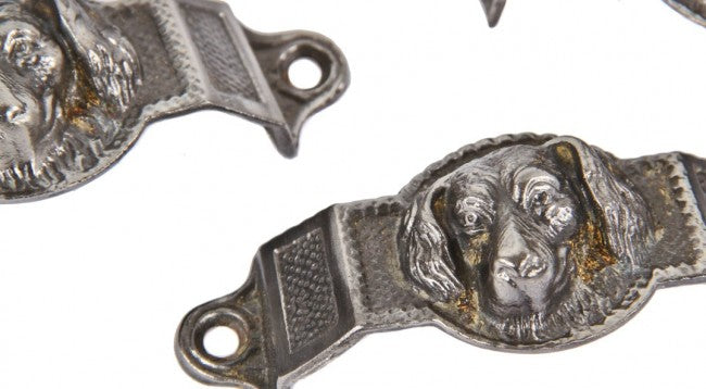 two matching original refinished ornamental cast iron figural "doggie" ornamental cast iron drawer pulls salvaged from a chicago brick two-flat residence built-in