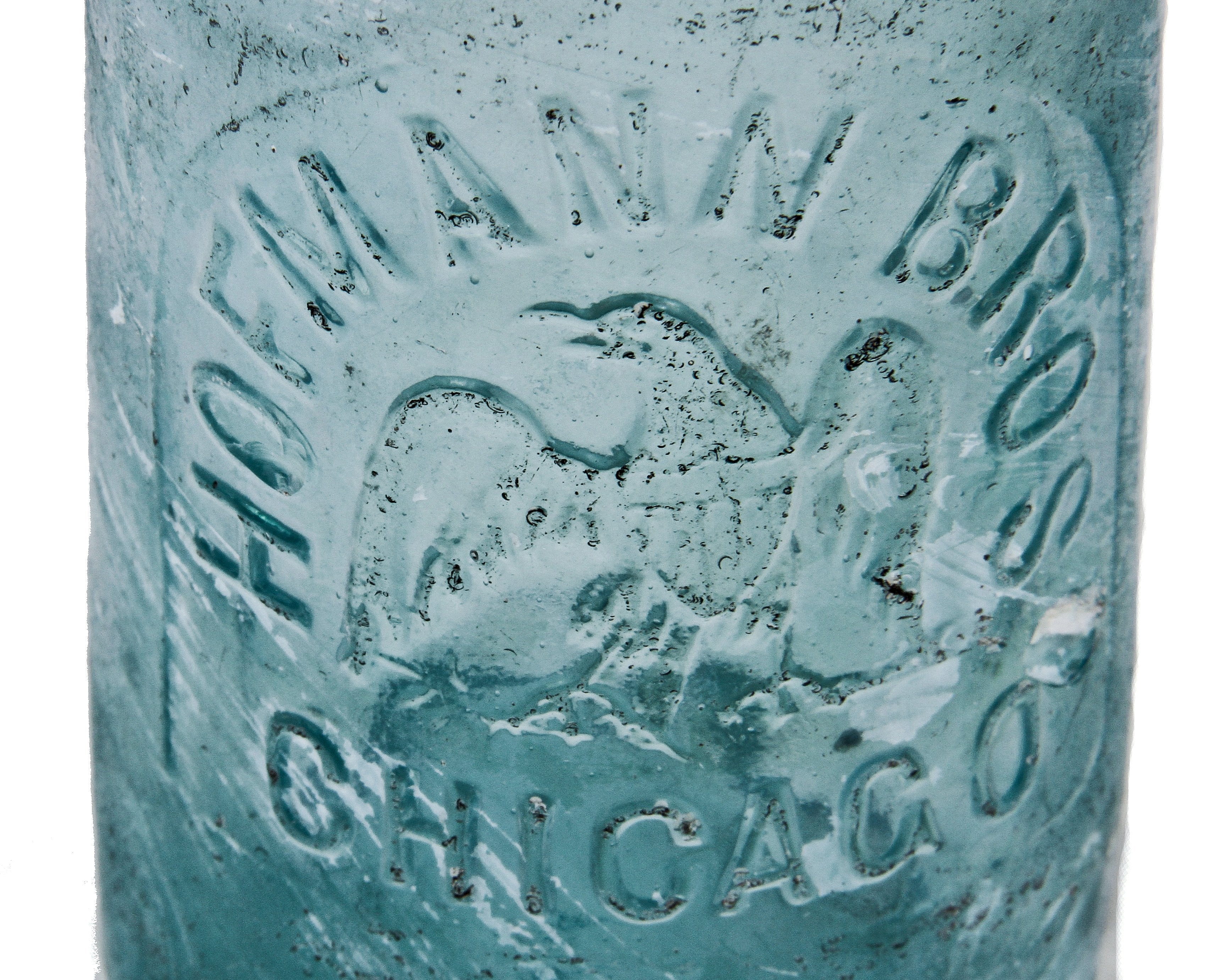 intact and original late nineteenth century privy-dug deep blue aqua hutchinson style bottle manufactured for the hofmann brothers in chicago.
