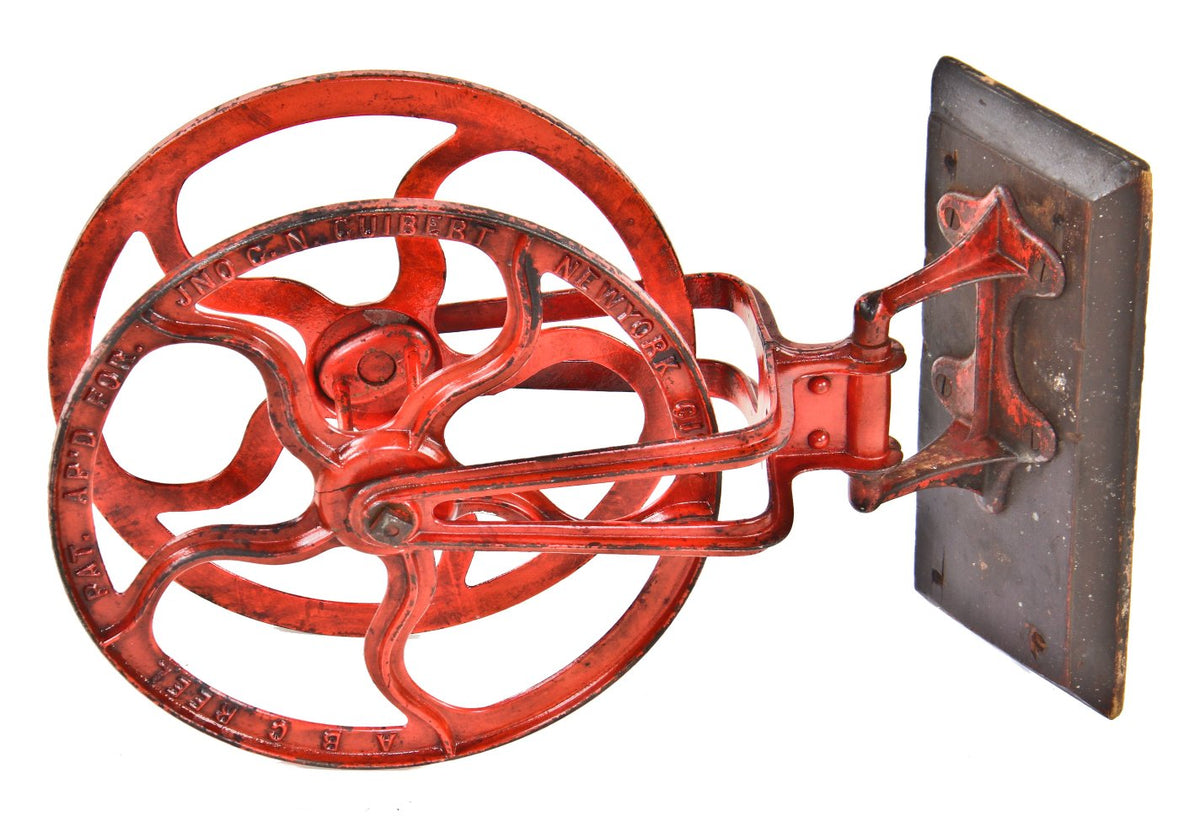 beautiful and rare 1890's fully functional american industrial swing-out ornamented cast iron fire hose reel bracket with original red paint finish largely intact