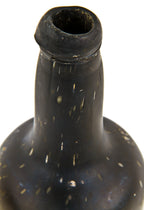 exceptionally rare and crude early nineteenth century black glass early style ale or lager bottle manufactured for unknown bottler.