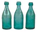 three matching privy dug mid-nineteenth century vibrant blue green glass iron pontiled soda bottles manufactured for william riddle in philadelphia, pa.