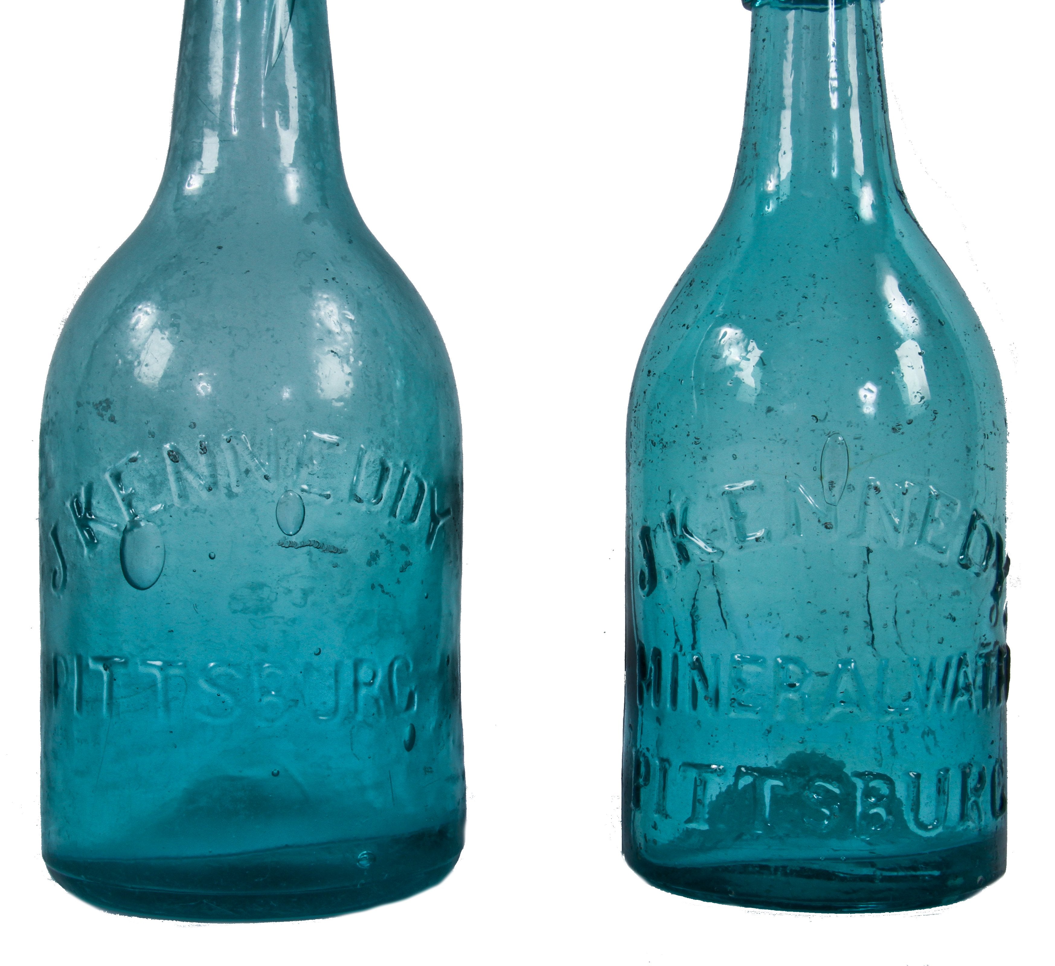 original and intact mid-nineteenth century dug pontiled teal porter style soda bottle manufactured for pittsburgh bottler joseph kennedy