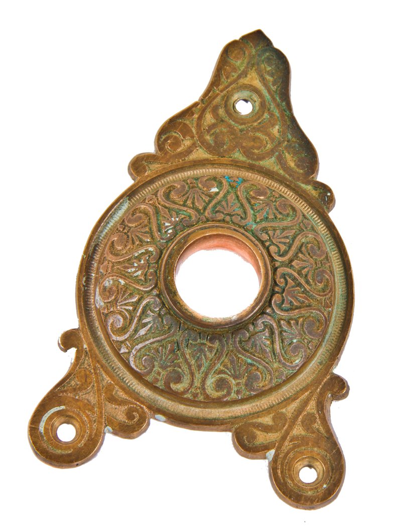original late 1870's american victorian era ornamental cast bronze triangular-shaped cast bronze oversized doorknob rosette from an entrance door lockset
