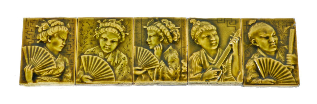 single 19th century yellow-brown majolica glazed intact residential parlor stove ceramic tile featuring a lightly embossed costumed geisha girl