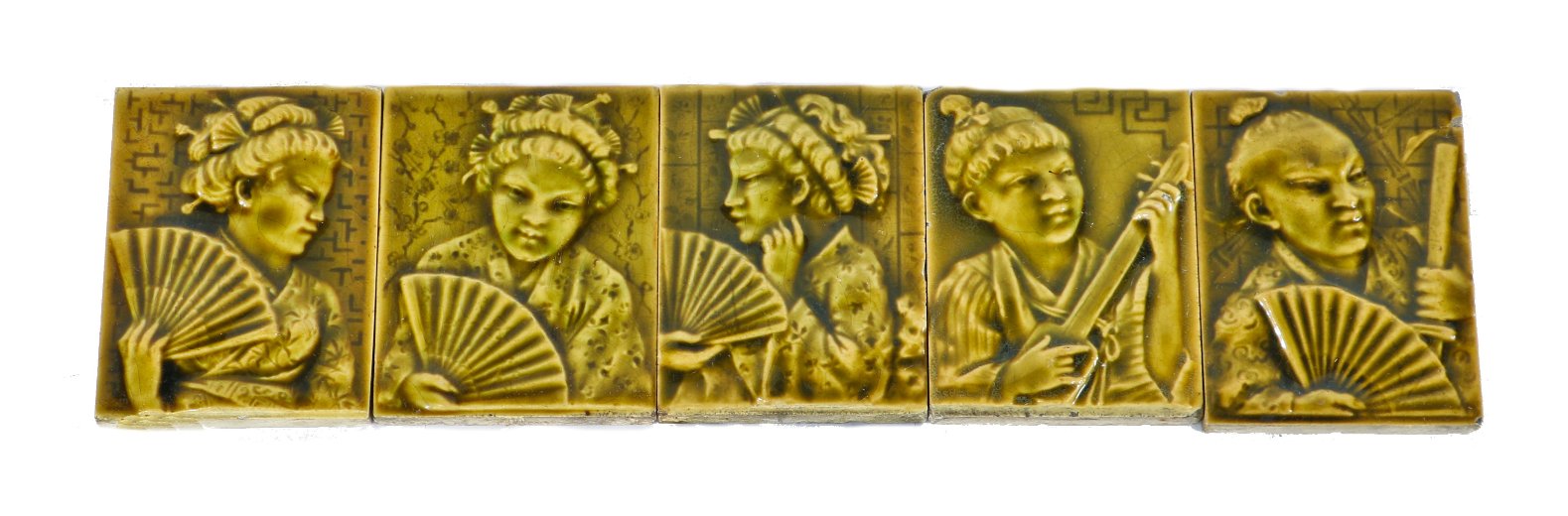 single 19th century yellow-brown majolica glazed intact residential parlor stove ceramic tile featuring a lightly embossed costumed geisha girl