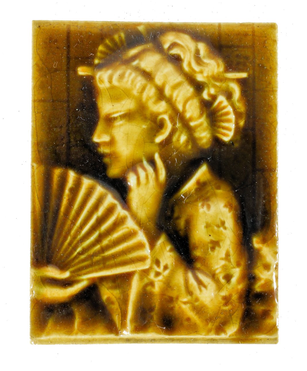single 19th century yellow-brown majolica glazed intact residential parlor stove ceramic tile featuring a lightly embossed costumed geisha girl