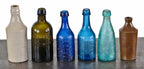 selection of mid-19th century soda, water, and/or ale glass bottles recovered from the chicago riverbed off the shore of wolf point in downtown chicago
