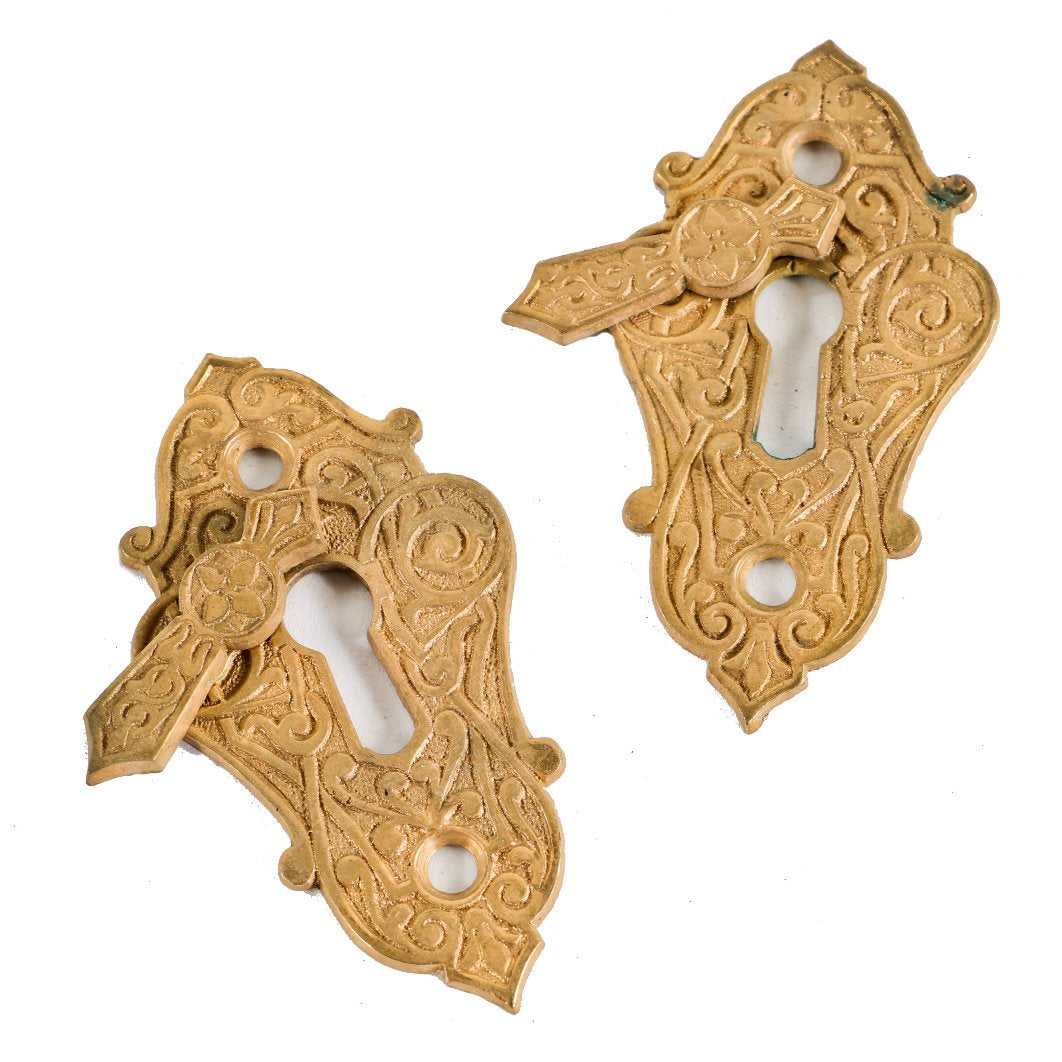 one of several sets of original late 1870's antique american ornamental cast bronze residential passage door keyplates with swinging covers