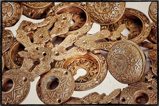 complete set of original 19th century ornamented cast bronze metal banded rim residential doorknob with matching decorative rosettes