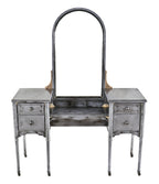 one of several matching original american depression era refinished pressed and folded steel simmons vanities with oversized arch top mirror