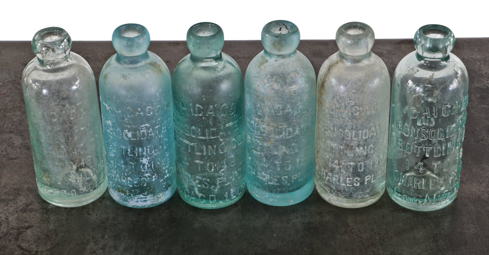 lot of six similar late 19th century chicago privy dug aqua glass chicago consolidated bottling company hutchinson blob top bottles