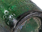 remarkable privy-dug mid-nineteenth century (1847-1849) dark emerald porter style bottle with applied single ring tapered lip and embossed with manufacturer's name