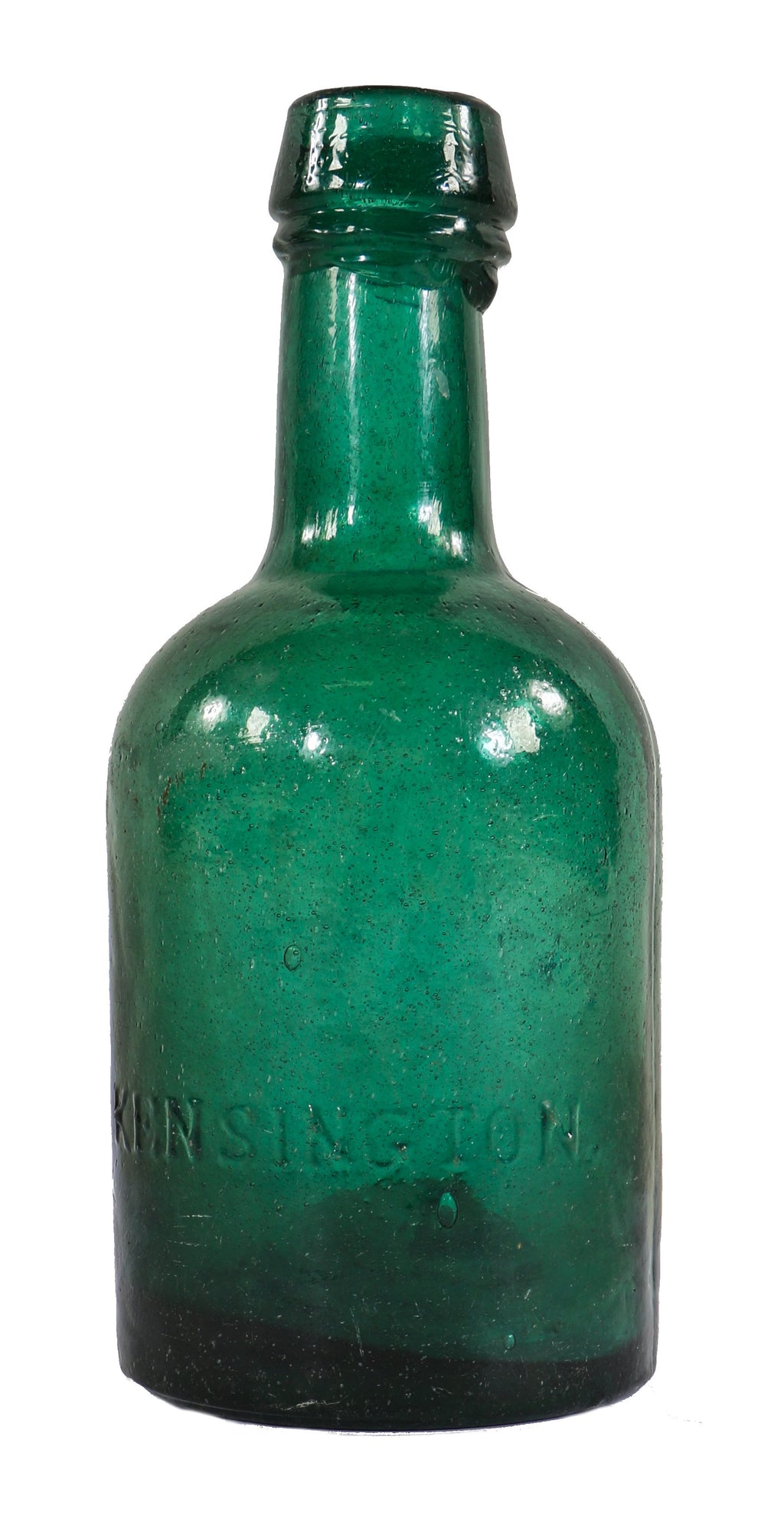 original and intact early nineteenth century deep emerald green porter shaped beer bottle manufactured by kensington glassworks.