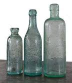 rare and all original privy dug tall aqua cylindrical medicinal "moxie" beverage bottle manufactured in chicago, il.