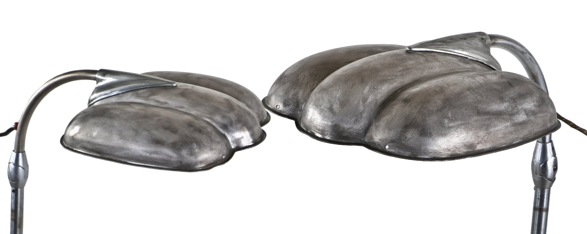 one of two matching fully adjustable and functional american depression era "sperti" light therapy sunlamps with a brushed metal finish sealed with a clear coat lacquer