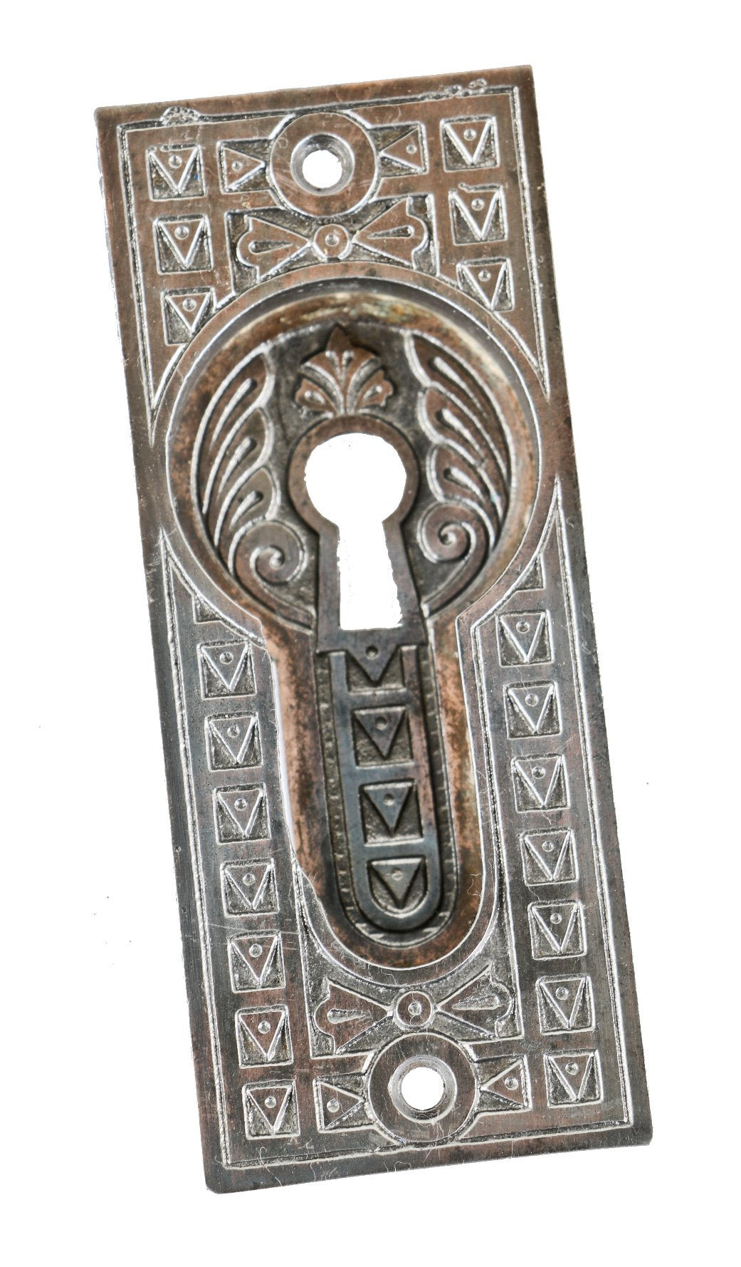 ornamental cast iron antique american 19th century single interior residential pocket door escutcheon or backplate with recessed handle containing a single keyhole