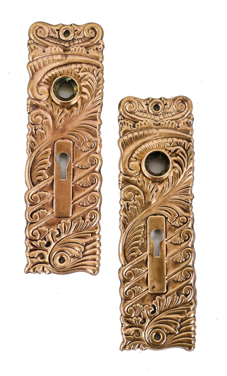 two matching visually striking late 19th or early 20th century stamped and/or wrought bronze metal art nouveau style interior passage door backplates
