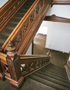 matching set of original 19th century antique american darkly stained walnut wood joseph t. ryerson upper staircase landing newel posts with centrally located baluster panel