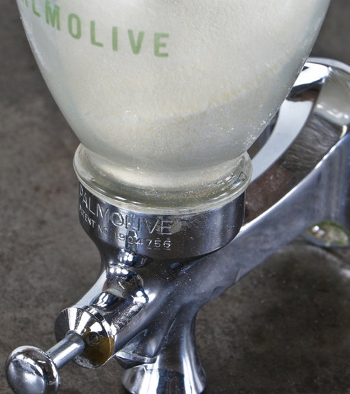 hard to find and completely intact and fully functional american made c. 1930's machine age "palmolive" brand wall-mount lavatory soap dispenser