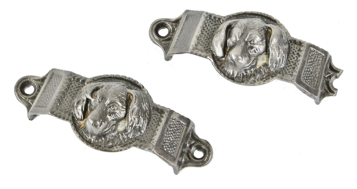 two matching original refinished ornamental cast iron figural "doggie" ornamental cast iron drawer pulls salvaged from a chicago brick two-flat residence built-in