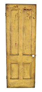 nicely worn and weathered old yellow painted pine wood pre-fire chicago four-panel door with original russell & erwin patented mortise lock and white porcelain doorknobs