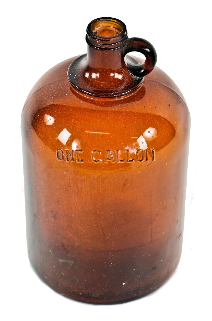 c. 1920's original dark amber colored american industrial oversized one gallon glass laboratory screw top jug with integrated circular-shaped handle