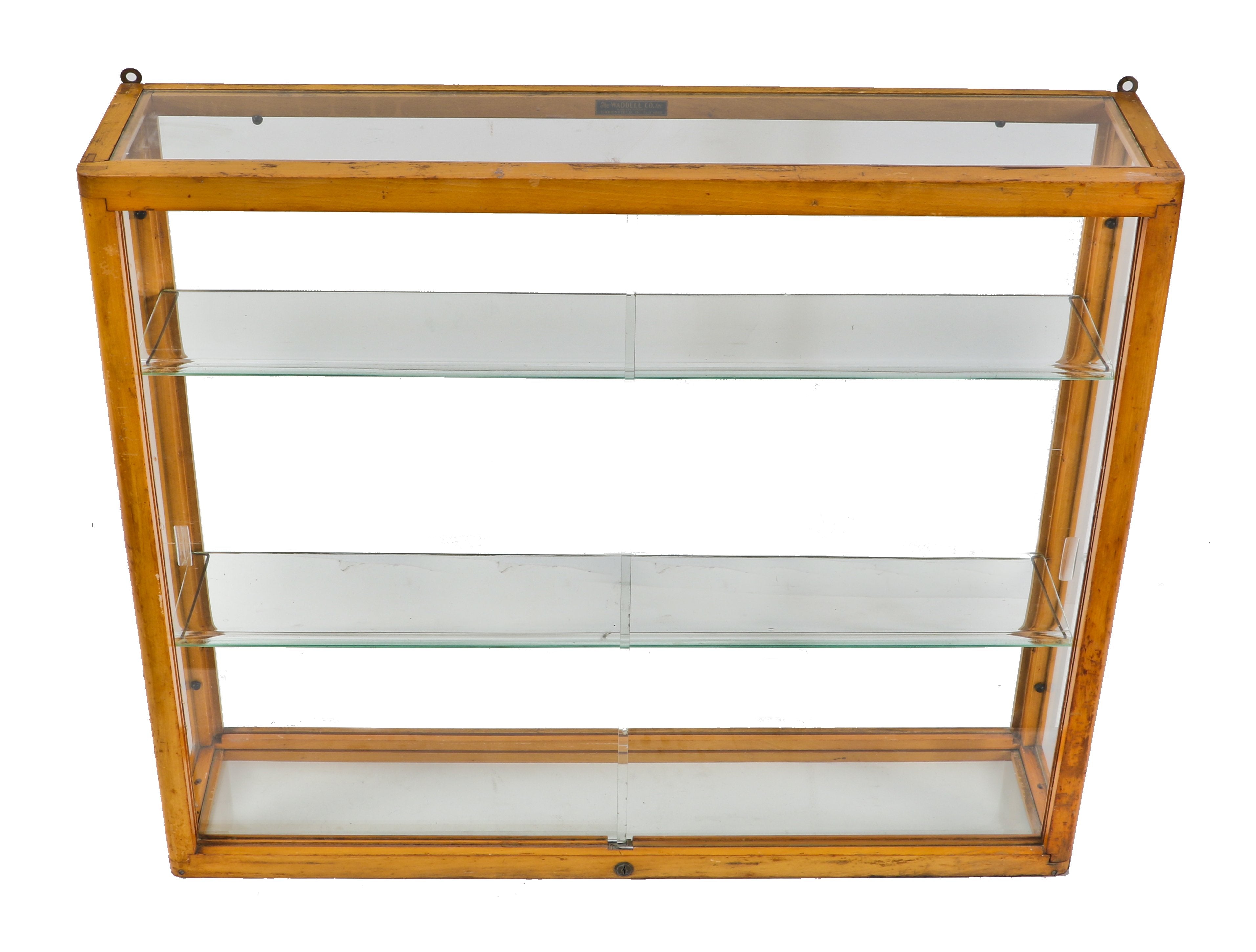 original and intact wall-mount early 1930's american depression-era waddell varnished maple wood compact display case with plate glass sliding doors and adjustable shelves