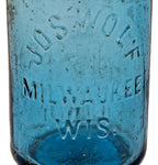 rare mid-nineteenth century privy-dug sapphire hutchinson soda bottle manufactured for jos wolf in milwaukee, wisconsin.