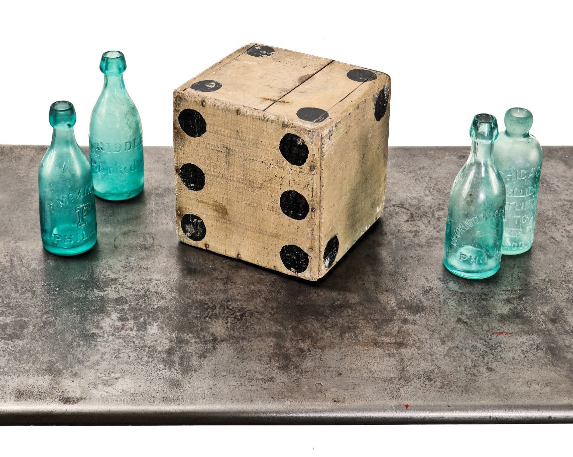 original and unusually large american depression era hand-painted pine wood folk art rounded edge hallow cube-shaped die with black "pips" against a weathered white paint finish