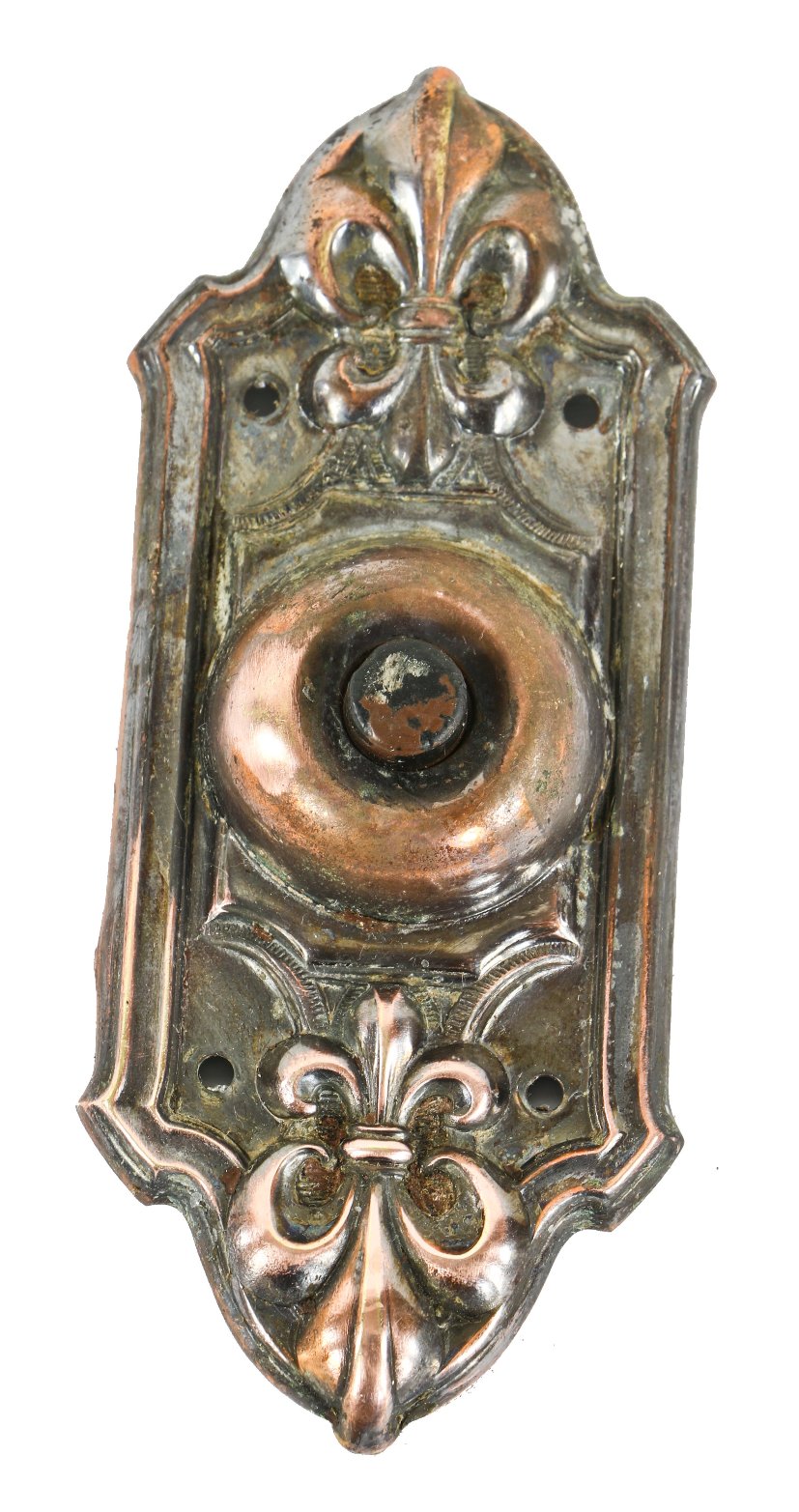 original early 20th century copper-plated pressed or stamped brass exterior residential push button doorbell with prominent fleur-de-lis design motif
