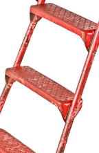 c. 1930's or 1940's american antique industrial reinforced tubular steel red painted collapsible ladder with riveted joint rungs or steps and raised edge tray