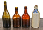 original and intact c. 1865-75 hard to find antique american amber glass squat quart ale bottle manufactured for william h. hutchinson bottling works.