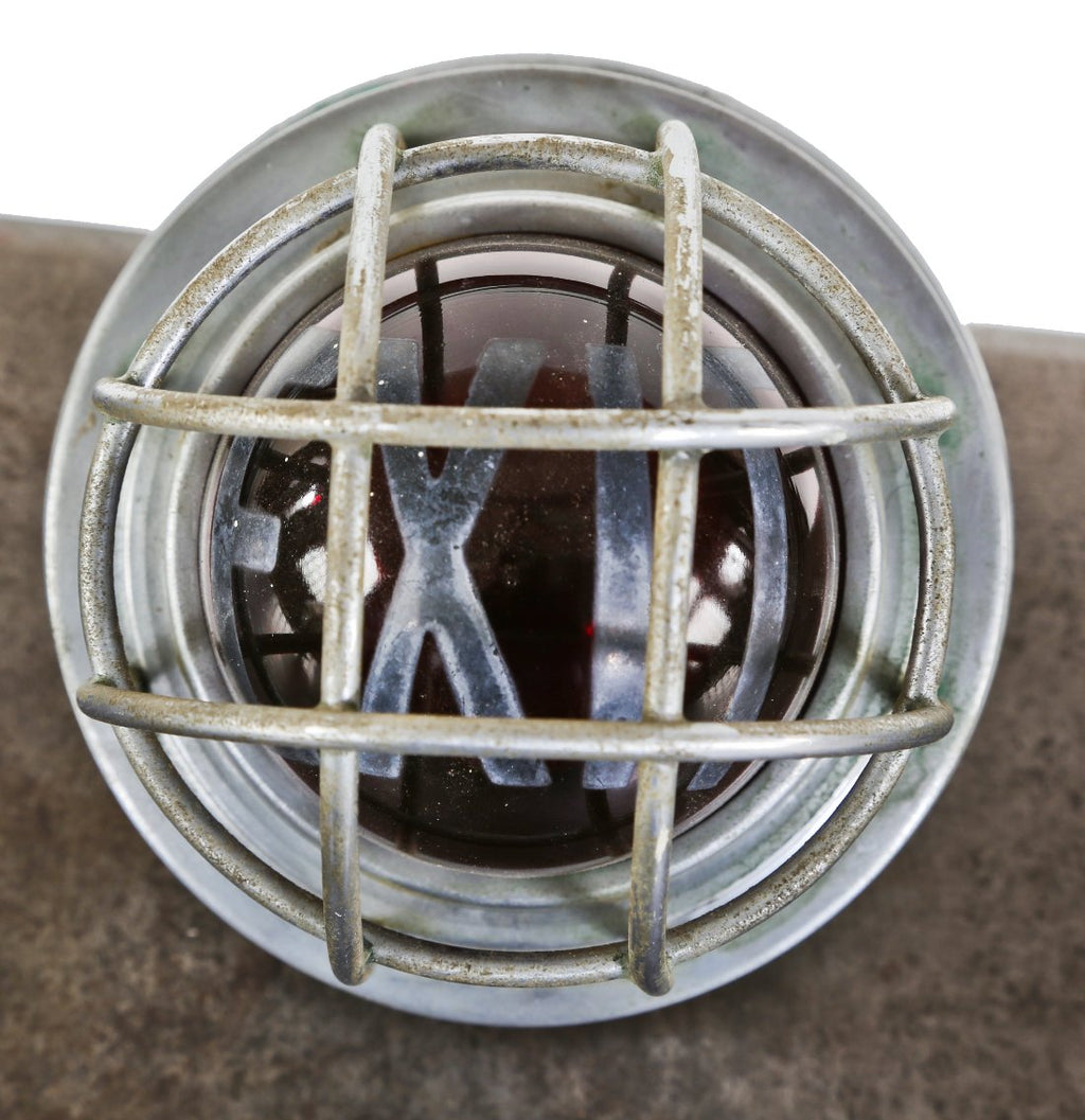 all original c. 1930's american depression era fully functional illuminated ruby red glass interior school gymnasium wall-mount exit light fixture with cage