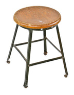 late 1930's original antique american industrial low-lying four-legged angled steel maple wood top factory stool with riveted joint angled steel base finished in the original factory green enamel over metal